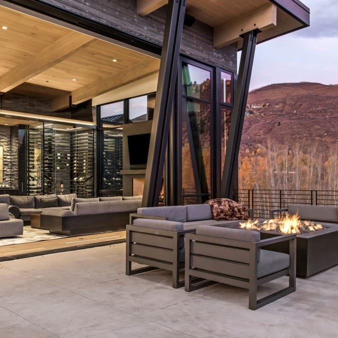 Indoor/Outdoor Living with Bi-Fold Sliding Doors and Fire Table