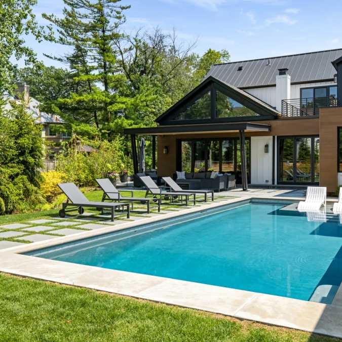 Indoor/Outdoor Living Space Overlooking In-ground Pool