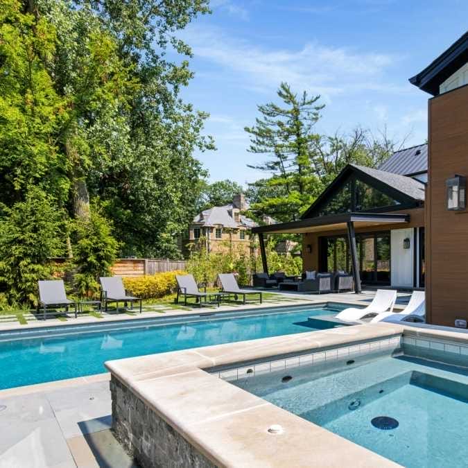 In-ground Hot Tub Overlooking Pool and Indoor/Outdoor Living Space