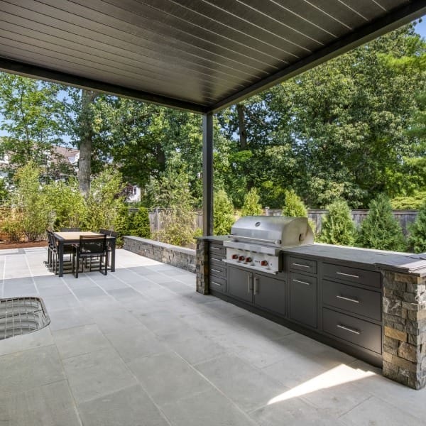 Azenco Louvered Pergola in Closed Position with Grill and Storage